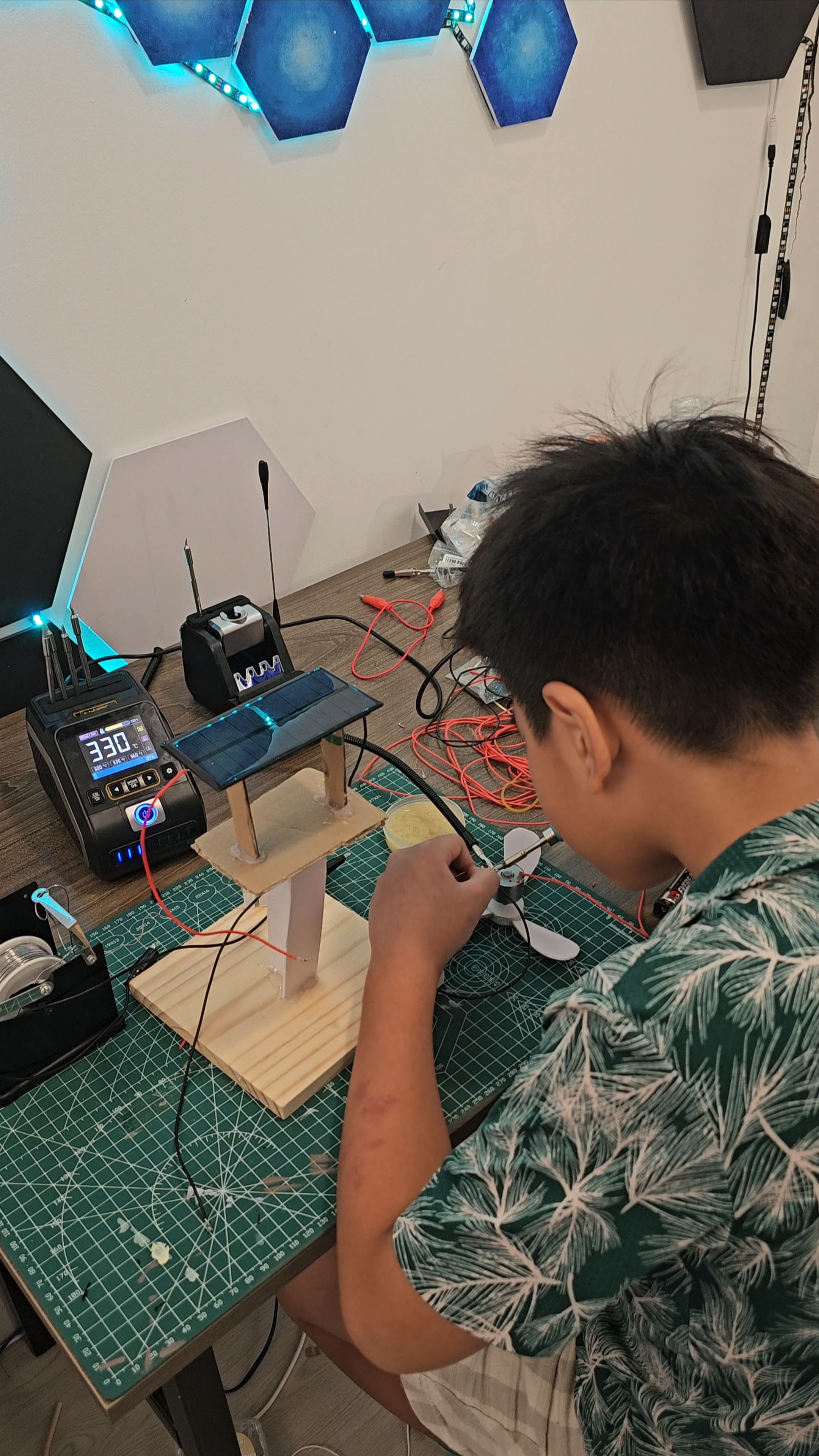 Students working on servo and sensor projects in Gadget Makers